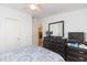 Cozy bedroom with ample storage and wood-look flooring, providing a functional and inviting space to unwind at 36246 Peak St, Zephyrhills, FL 33541