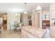 Open-concept kitchen flowing into a dining and living area, perfect for entertaining and everyday living at 36246 Peak St, Zephyrhills, FL 33541