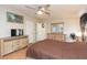 Bright bedroom featuring neutral colors and a large dresser for plenty of storage space at 36246 Peak St, Zephyrhills, FL 33541