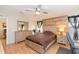 Well-lit bedroom with natural wood tones and a cozy decor, offering comfort and style at 36246 Peak St, Zephyrhills, FL 33541