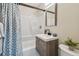 Bathroom with a shower, sleek vanity, modern faucet, and a decorative plant for a refreshing touch at 3907 Elkcam Se Blvd, St Petersburg, FL 33705