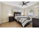 Bedroom with a ceiling fan and a comfortable bed with bedside tables and lamps. Natural light streams in through the windows at 3907 Elkcam Se Blvd, St Petersburg, FL 33705