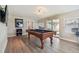 Game room with pool table and wood-look floors offers entertainment and relaxation at 3907 Elkcam Se Blvd, St Petersburg, FL 33705