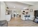 Spacious open-concept living room with seating, kitchen bar, and stainless appliances at 3907 Elkcam Se Blvd, St Petersburg, FL 33705