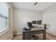 Office featuring a large desk and chair, with a window providing natural light and a view of the outside at 3907 Elkcam Se Blvd, St Petersburg, FL 33705