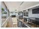 Inviting screened patio with table seating, a grill, and outdoor fans for comfortable entertaining at 3907 Elkcam Se Blvd, St Petersburg, FL 33705