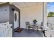 Inviting front porch with brick accent, seating, and a welcome mat at 3907 Elkcam Se Blvd, St Petersburg, FL 33705