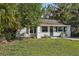 Charming one-story home with a well-maintained lawn and a neatly landscaped front yard at 3915 N Ola Ave, Tampa, FL 33603
