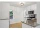 Modern kitchen featuring stainless steel appliances, granite countertops and ample cabinet space at 3915 N Ola Ave, Tampa, FL 33603