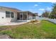 Lawn area with a screened-in patio in a large backyard at 4421 Larkenheath Dr, Spring Hill, FL 34609