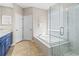 Bathroom featuring a separate shower and soaking tub with tile flooring at 4421 Larkenheath Dr, Spring Hill, FL 34609