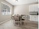 Dining area with a window and wood-look tile flooring at 4421 Larkenheath Dr, Spring Hill, FL 34609