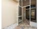 Inviting tiled entryway with a screen door welcomes you into the home at 4421 Larkenheath Dr, Spring Hill, FL 34609
