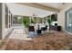 Large screened-in patio with brick flooring and outdoor furniture at 4421 Larkenheath Dr, Spring Hill, FL 34609