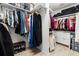 Organized walk-in closet with ample storage solutions, including shelves and hanging rods at 4421 Larkenheath Dr, Spring Hill, FL 34609