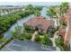 Luxury condos with waterfront access and ample parking surrounded by lush landscaping at 5000 Culbreath Key Way # 9-102, Tampa, FL 33611