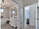 Elegant bathroom with a chandelier, vanity, and a separate bathtub at 5000 Culbreath Key Way # 9-102, Tampa, FL 33611
