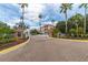 Gated community entrance featuring manicured landscaping, creating a secure and welcoming atmosphere at 5000 Culbreath Key Way # 9-102, Tampa, FL 33611
