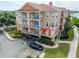 Beautiful condo building featuring Mediterranean architecture, balconies, a parking area and waterfront access at 5000 Culbreath Key Way # 9-102, Tampa, FL 33611