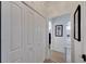 Well-lit hallway with closet space, leading to other rooms in the home at 5000 Culbreath Key Way # 9-102, Tampa, FL 33611