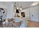 Stylish kitchen bar with seating, modern white cabinets, and granite countertops offering a perfect area for dining at 5000 Culbreath Key Way # 9-102, Tampa, FL 33611
