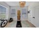 Inviting fitness room with a chandelier, hardwood floors, and natural light at 5000 Culbreath Key Way # 9-102, Tampa, FL 33611
