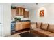 Stylish bar area with wood cabinets, granite countertops, and a wine fridge at 5229 Brighton Shore Dr, Apollo Beach, FL 33572