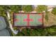 Aerial view of well-maintained community basketball courts, surrounded by greenery and walking paths at 5229 Brighton Shore Dr, Apollo Beach, FL 33572