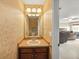 Bathroom featuring a single vanity and a glimpse into the bedroom area at 5229 Brighton Shore Dr, Apollo Beach, FL 33572