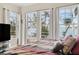 Bright bedroom featuring large windows offering stunning waterfront views, complete with stylish bedding and modern decor at 5229 Brighton Shore Dr, Apollo Beach, FL 33572