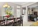 Bright dining room features a modern chandelier and large windows with beautiful water views at 5229 Brighton Shore Dr, Apollo Beach, FL 33572
