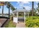 Charming community gazebo surrounded by green landscaping and a peaceful lake view at 5229 Brighton Shore Dr, Apollo Beach, FL 33572