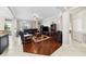 Cozy living room with hardwood floors, a ceiling fan, and a comfortable leather sofa at 5229 Brighton Shore Dr, Apollo Beach, FL 33572