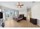 Bright main bedroom with waterfront views, wood floors, and an ensuite bathroom at 5229 Brighton Shore Dr, Apollo Beach, FL 33572