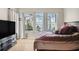 Bright bedroom featuring large windows with waterfront views and ample natural light at 5229 Brighton Shore Dr, Apollo Beach, FL 33572