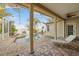A covered patio area with a beautiful pool and a spa that overlooks the water at 5229 Brighton Shore Dr, Apollo Beach, FL 33572