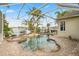 A luxurious screened pool and spa area with brick pavers and waterfront views at 5229 Brighton Shore Dr, Apollo Beach, FL 33572