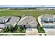 Aerial view of a well maintained single Gathering home with mature landscaping, solar panels, and 2-car garage at 5317 Del Coronado Dr, Apollo Beach, FL 33572