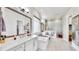 Spacious bathroom with double vanity, walk-in shower, soaking tub and open walk-in closet at 5317 Del Coronado Dr, Apollo Beach, FL 33572