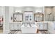 Beautiful bathroom featuring double vanity, soaking tub, and a large window at 5317 Del Coronado Dr, Apollo Beach, FL 33572