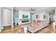Spacious living room with fireplace, modern decor, and wood floors at 5317 Del Coronado Dr, Apollo Beach, FL 33572