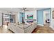 Spacious living room with comfortable seating, a modern fireplace, and access to the lanai and bedroom at 5317 Del Coronado Dr, Apollo Beach, FL 33572