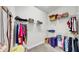 Walk-in closet with white wire shelves and carpeted floors at 5317 Del Coronado Dr, Apollo Beach, FL 33572