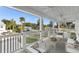 Relaxing covered balcony with comfortable seating and scenic views at 6841 Oelsner St, New Port Richey, FL 34652