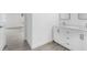 Sleek bathroom with double vanity, white cabinets, and modern fixtures at 6841 Oelsner St, New Port Richey, FL 34652
