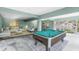Spacious open floorplan living area with pool table and comfortable seating at 6841 Oelsner St, New Port Richey, FL 34652