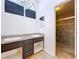 Bathroom with double sink vanity and walk-in shower at 8600 Berkley Dr, Hudson, FL 34667
