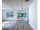 Bright dining area with bay windows, natural light, and views of the outdoors at 8600 Berkley Dr, Hudson, FL 34667