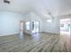 Bright living room with hardwood flooring, access to the patio, and modern finishes at 8600 Berkley Dr, Hudson, FL 34667