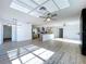 Bright, open living space features an updated kitchen, fireplace, neutral flooring, and recessed lighting at 8600 Berkley Dr, Hudson, FL 34667